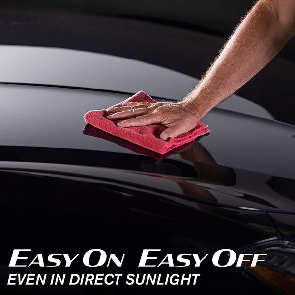 Ceramic car wax application on black paint. Turtle Wax Hybrid Solutions provides easy on, easy off shine, even in direct sunlight.